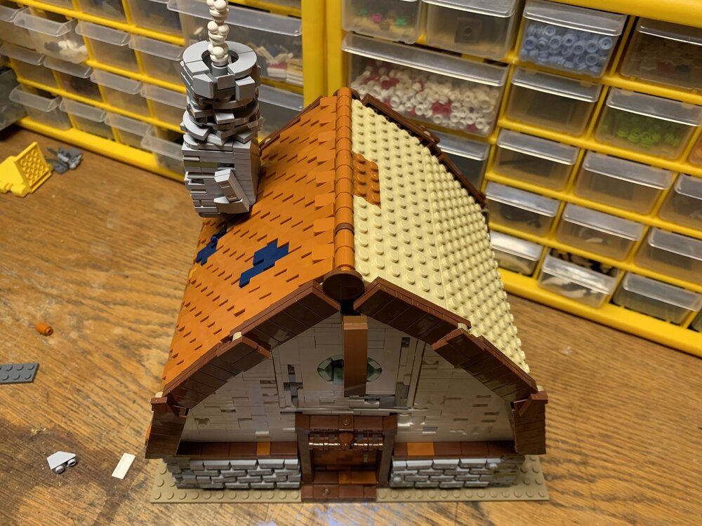 25 adding tiles to the roof.jpg